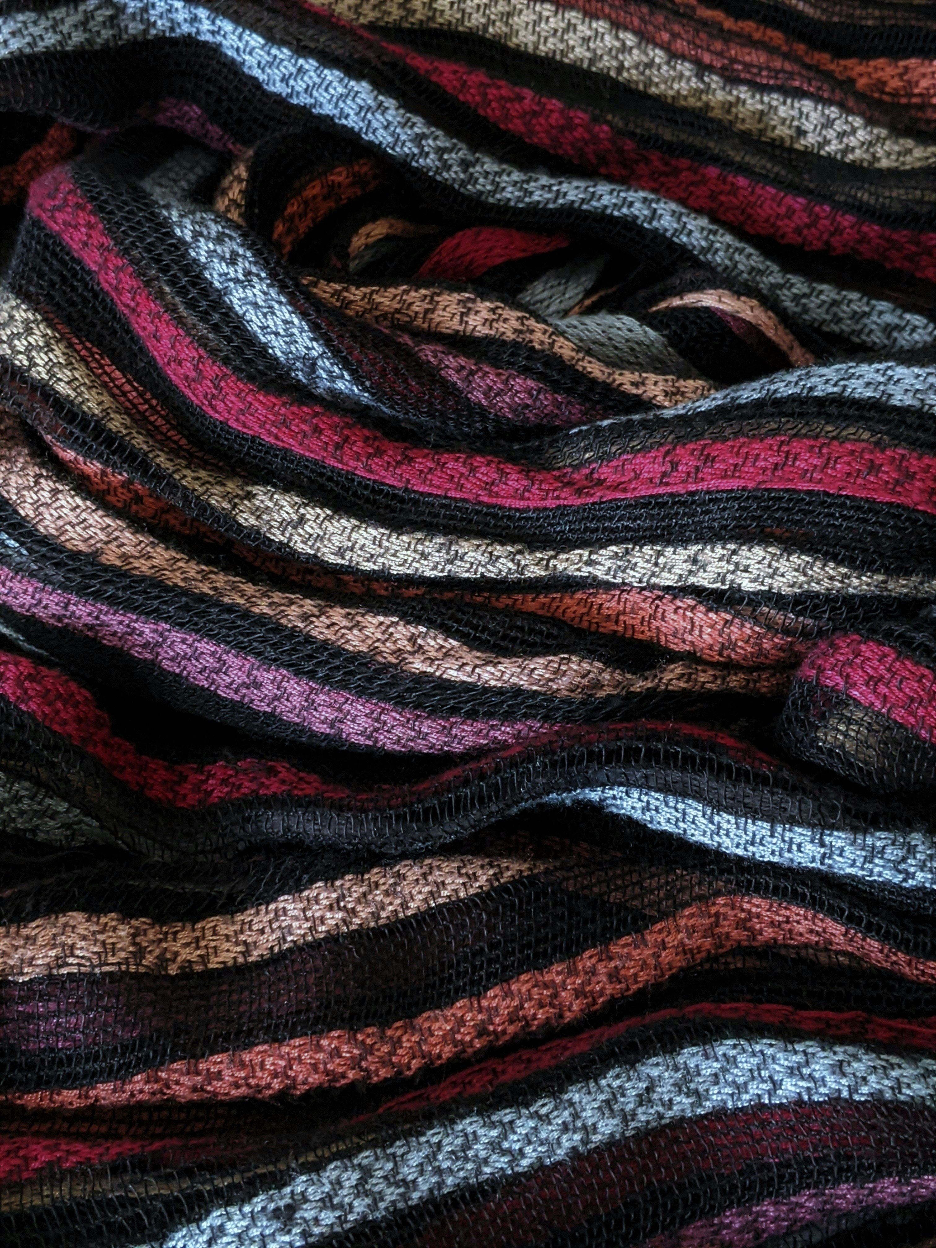 red black and white striped textile