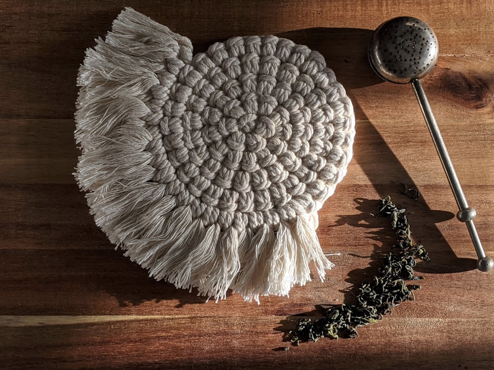 white knit textile on brown wooden table