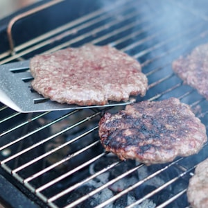 brown meat on black grill