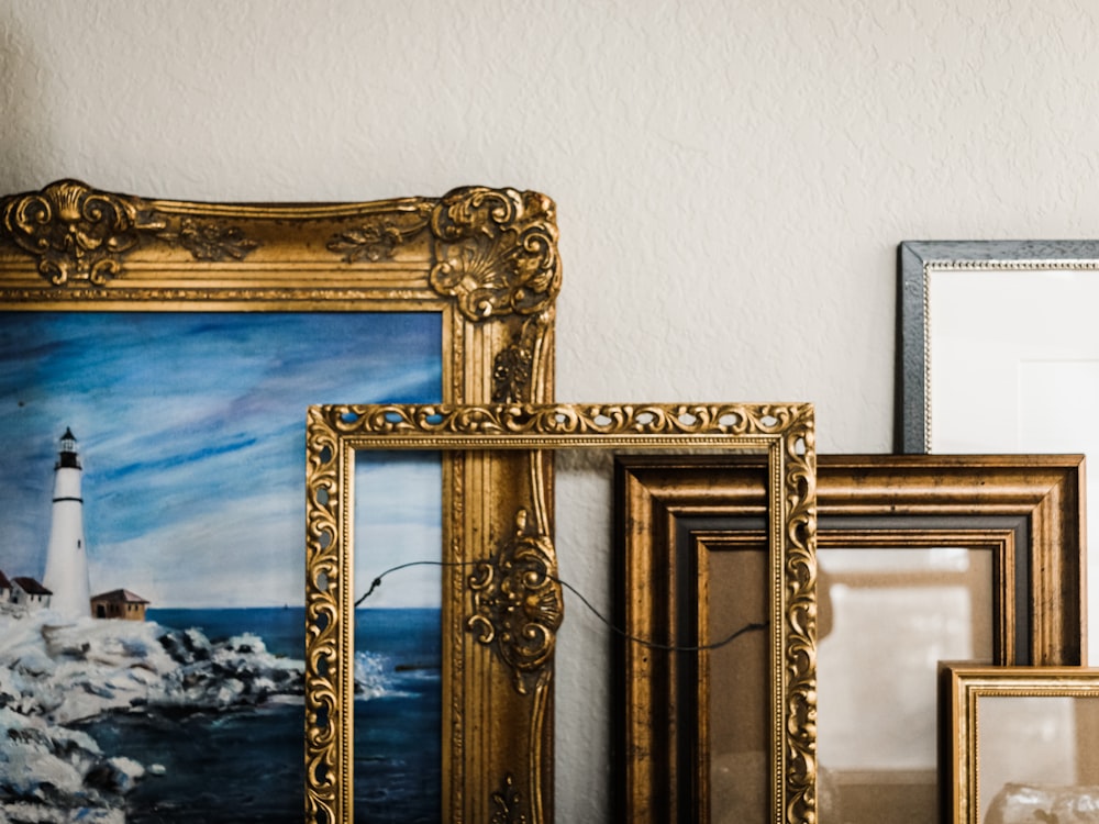 gold framed mirror on white wall