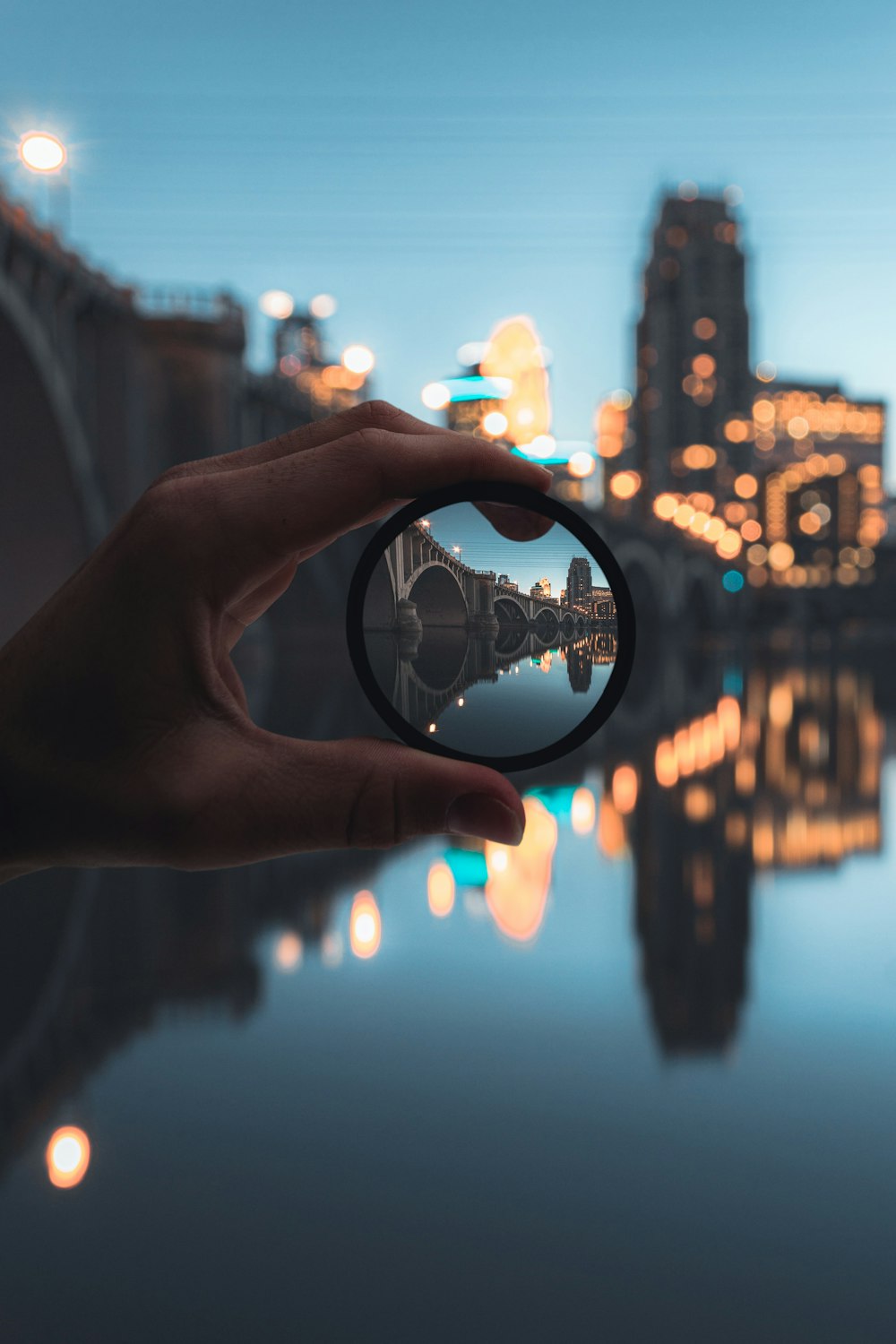 person holding magnifying glass during night time