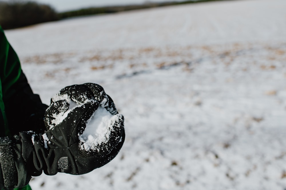 black heart shaped ornament on white sand