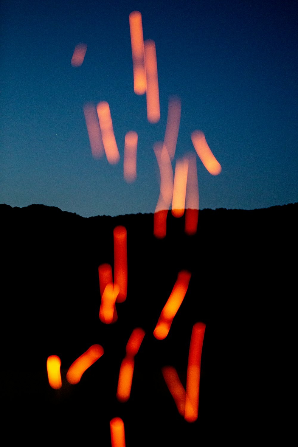 silhouette of mountain during night time