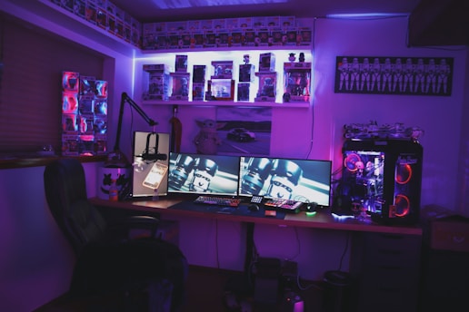black flat screen tv on black wooden table