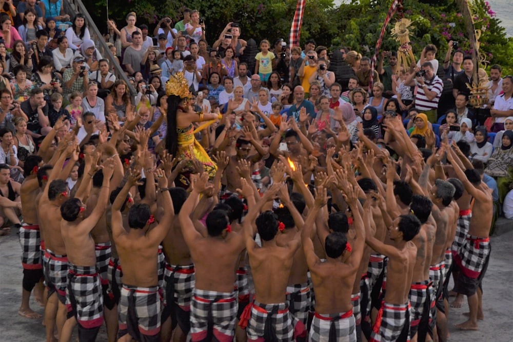 group of men raising their hands