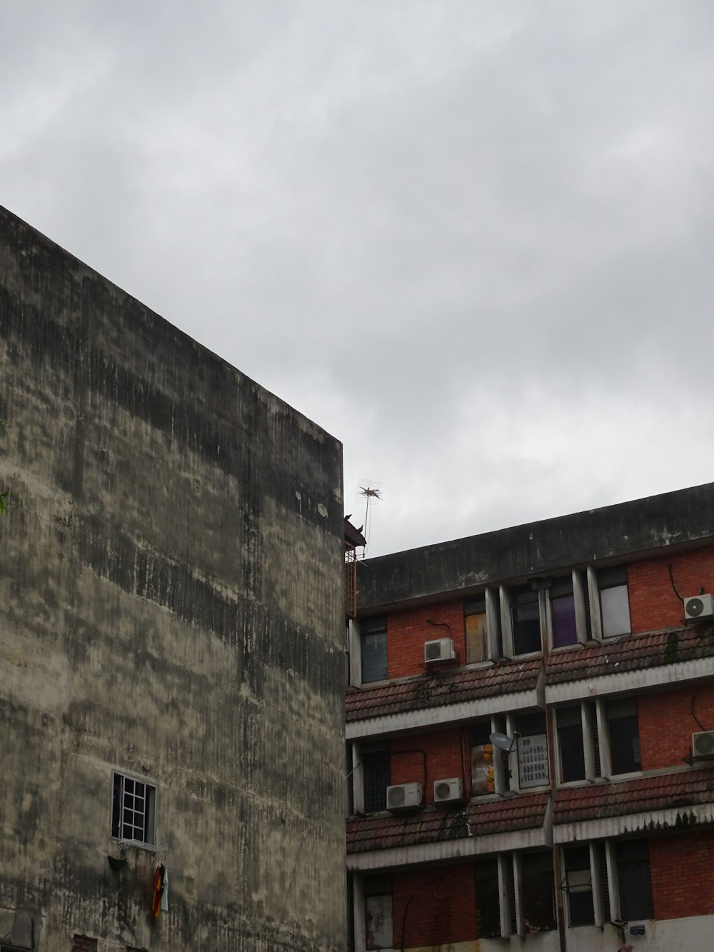 gray concrete building under white sky during daytime