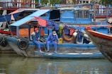 A couple enjoying a scenic boat ride through the colorful streets of Cartagena, Colombia.