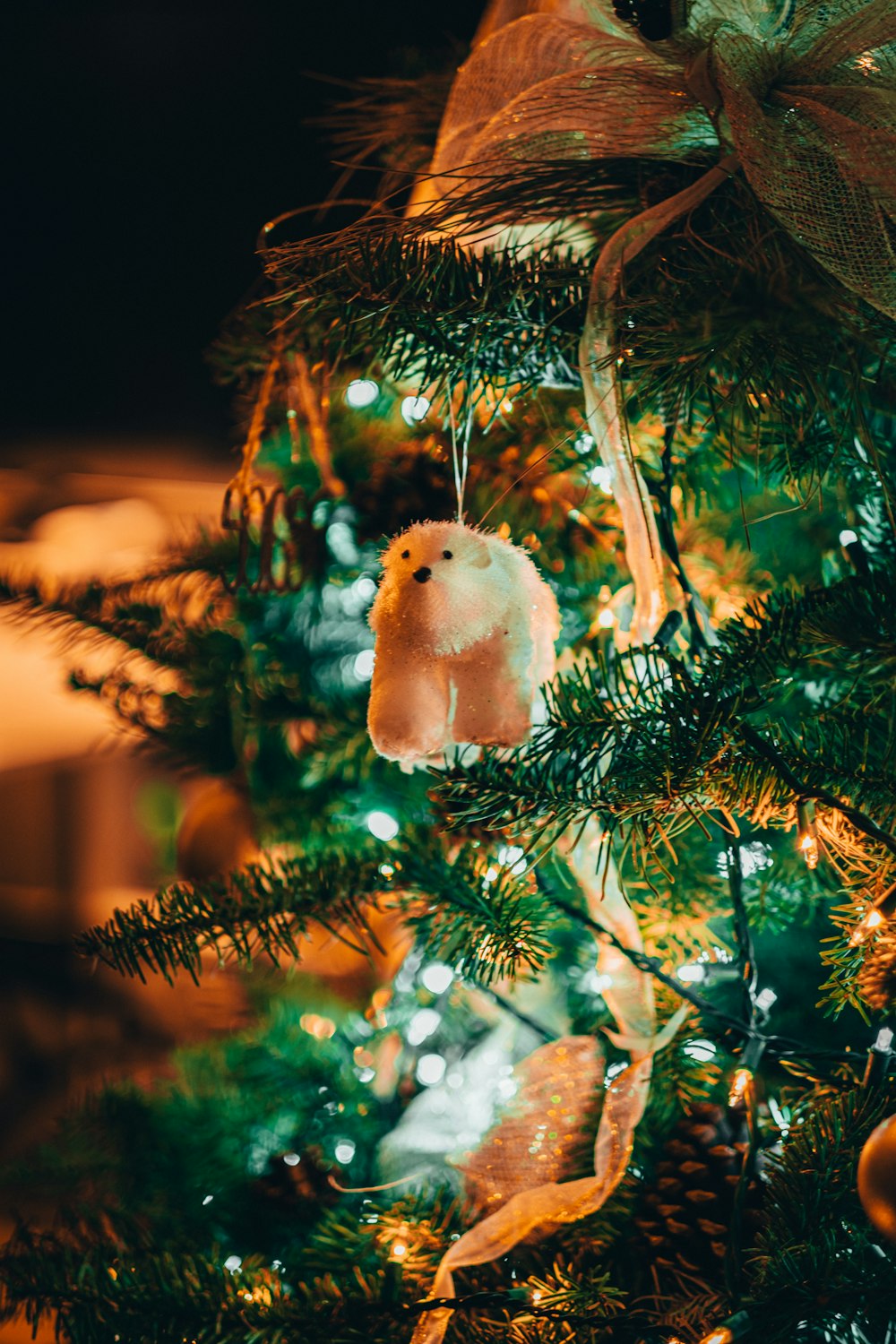 white fur animal on green tree