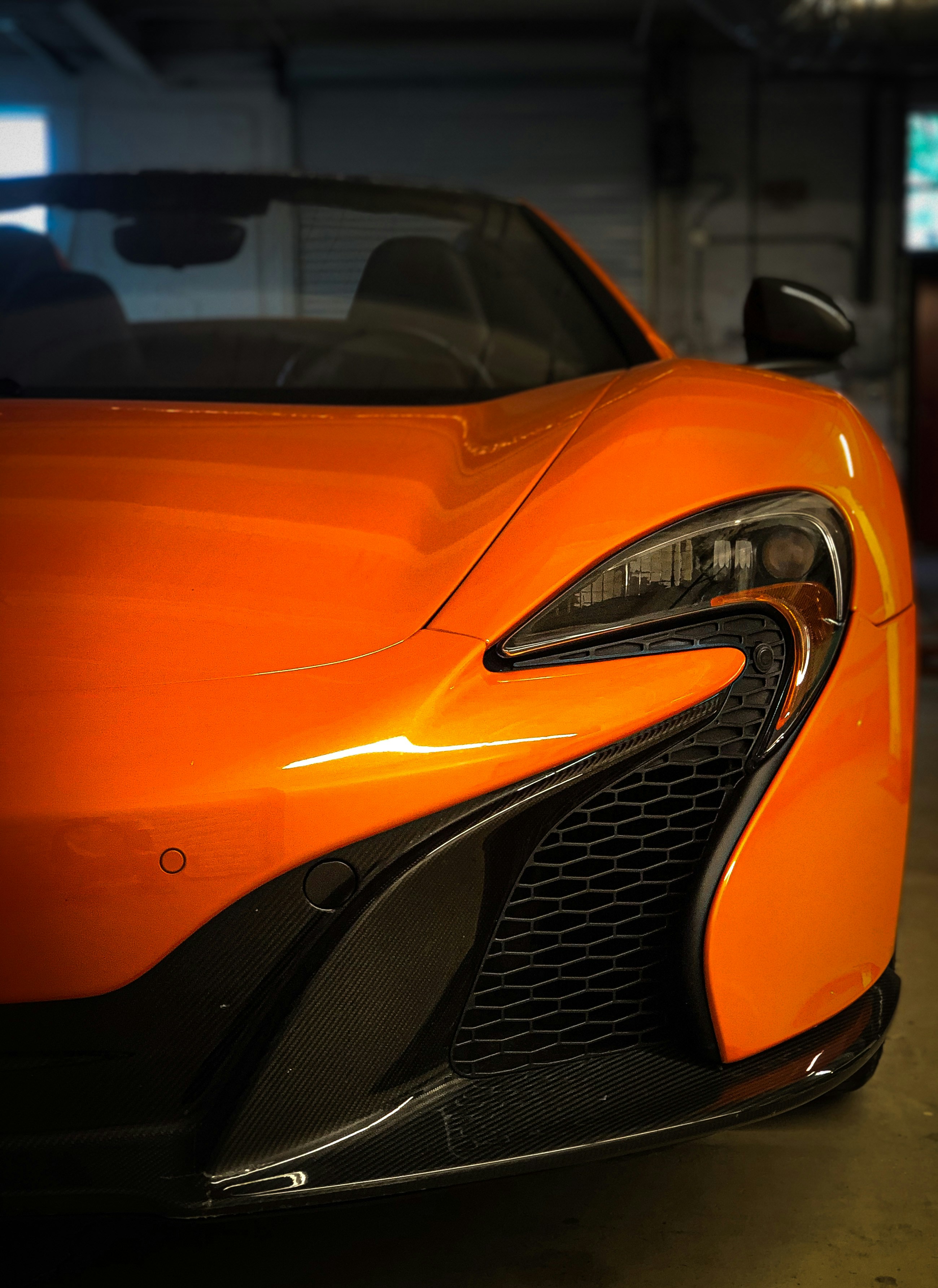 orange lamborghini aventador in a parking lot
