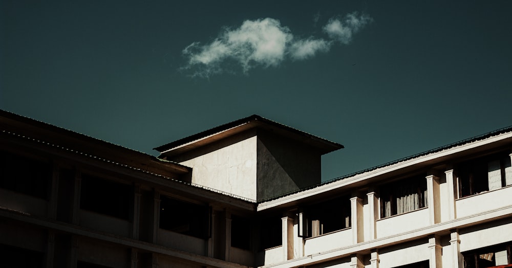 brown and white concrete building under blue sky during daytime