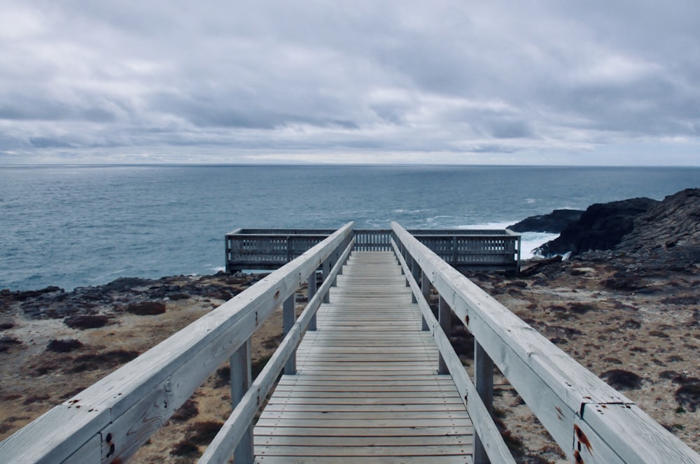 white wooden dock on sea during daytime