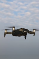 black and gray drone in mid air