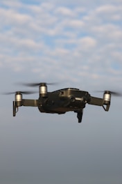 black and gray drone in mid air