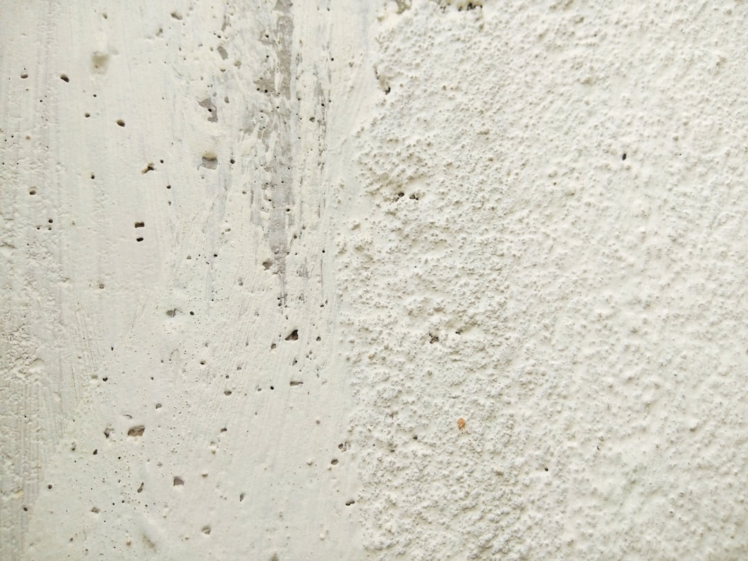 white concrete wall with water droplets