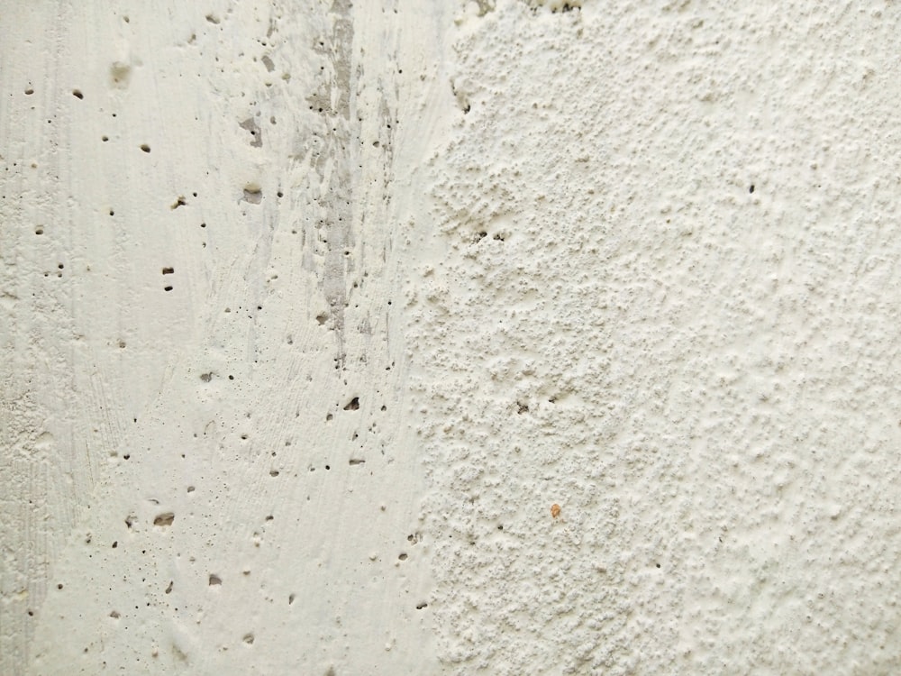 white concrete wall with water droplets
