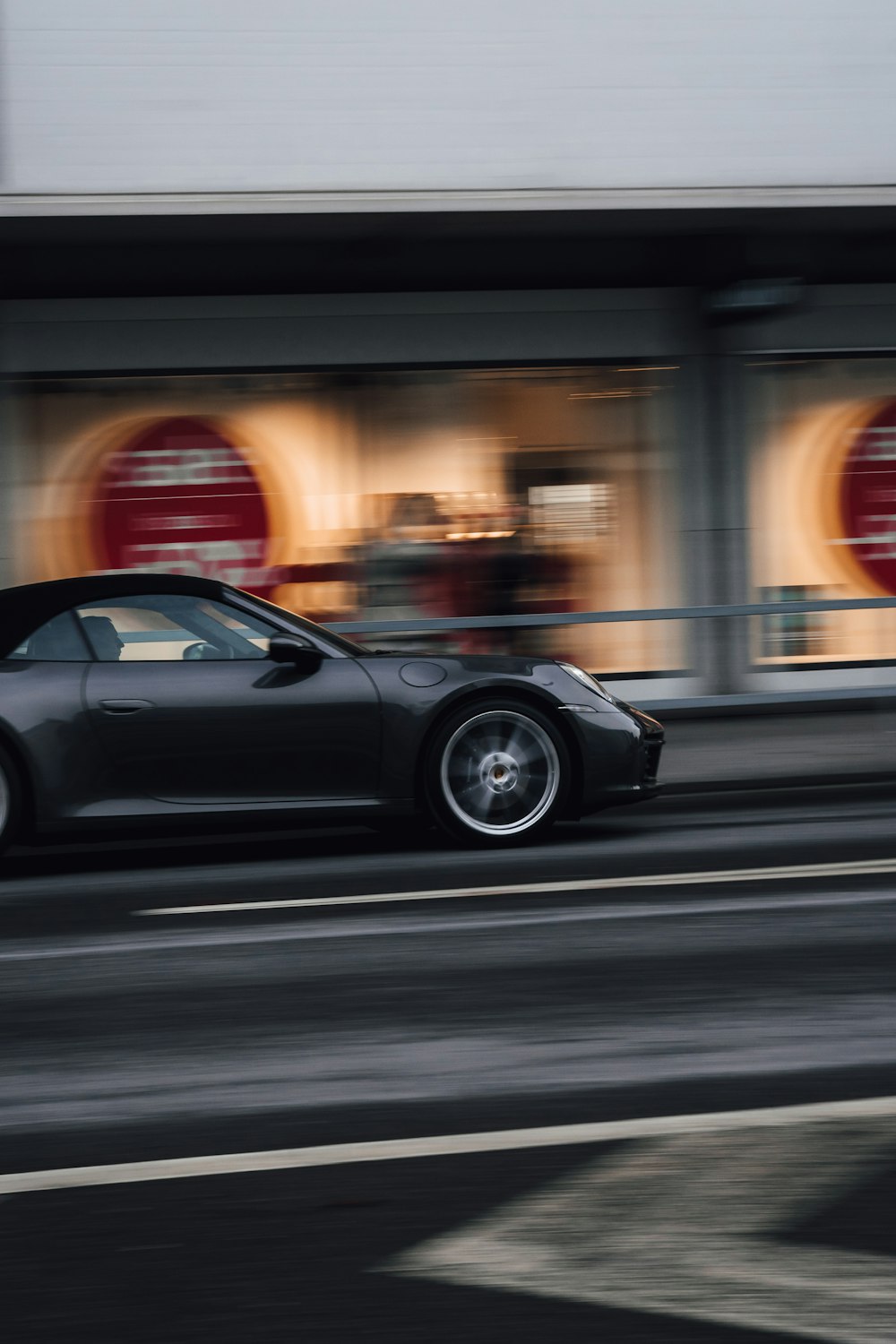 black coupe on road during night time