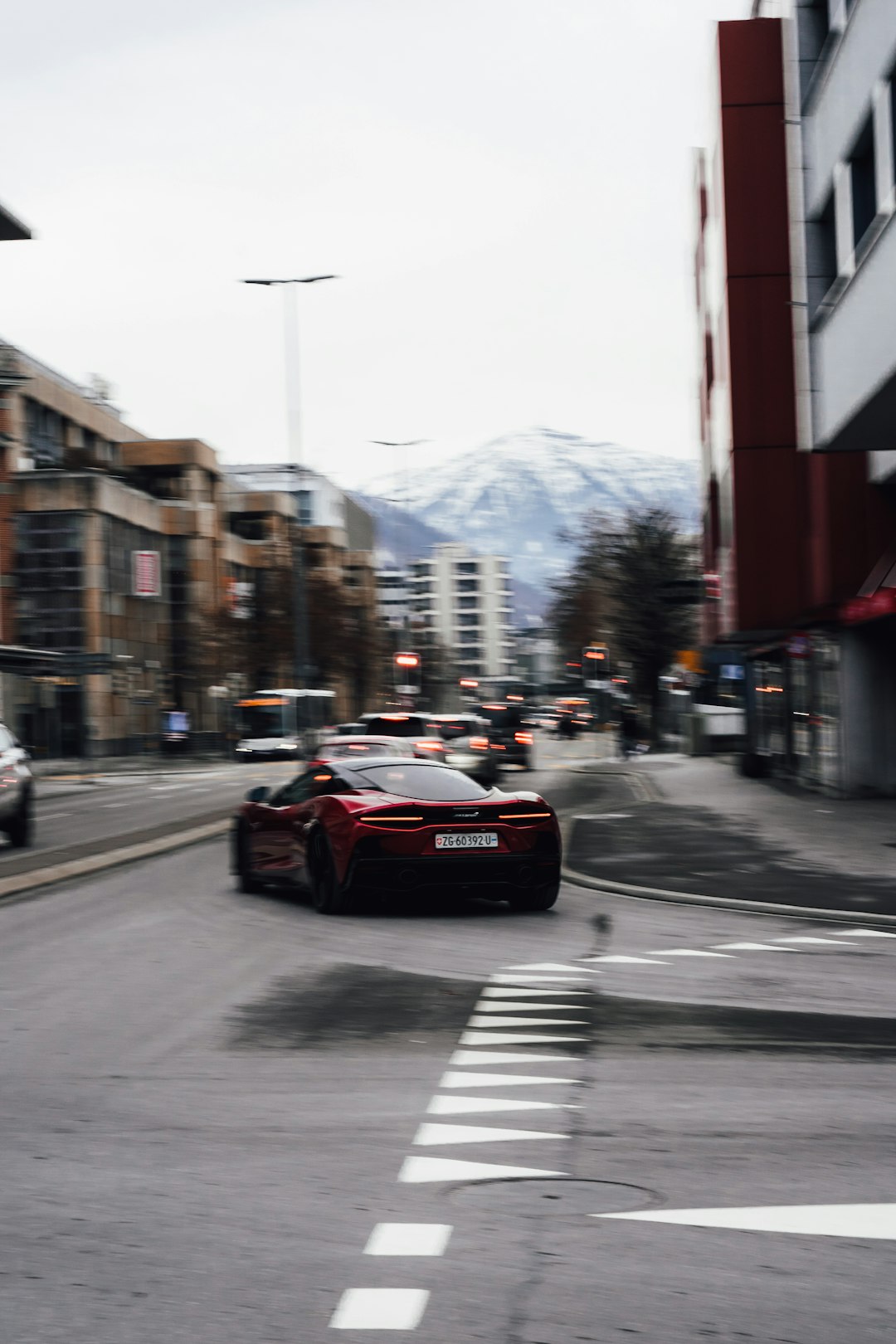 red car on road during daytime