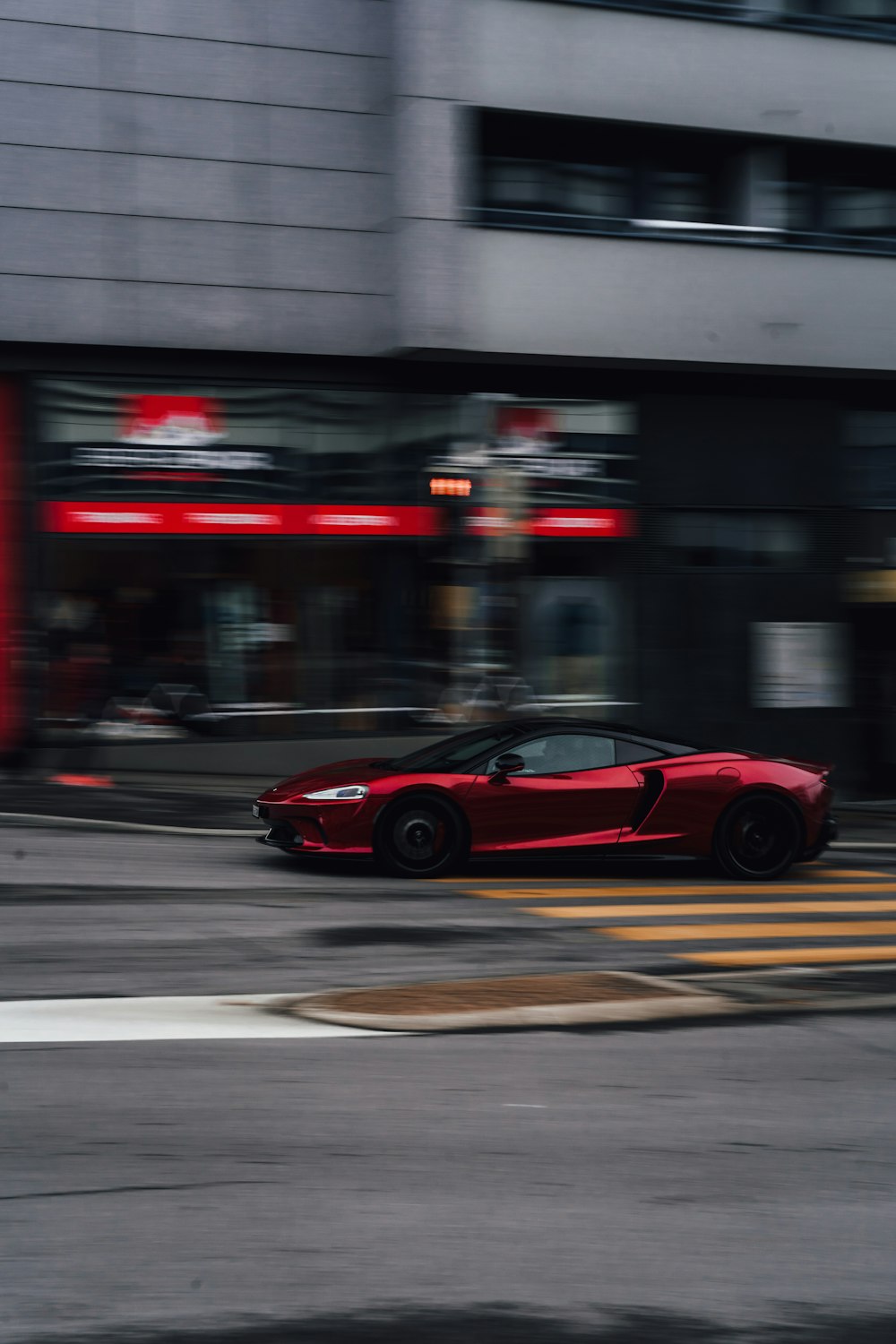 red ferrari 458 italia on road during night time