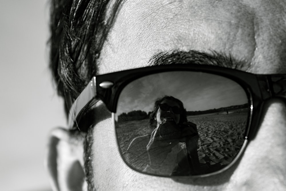 man wearing black framed sunglasses