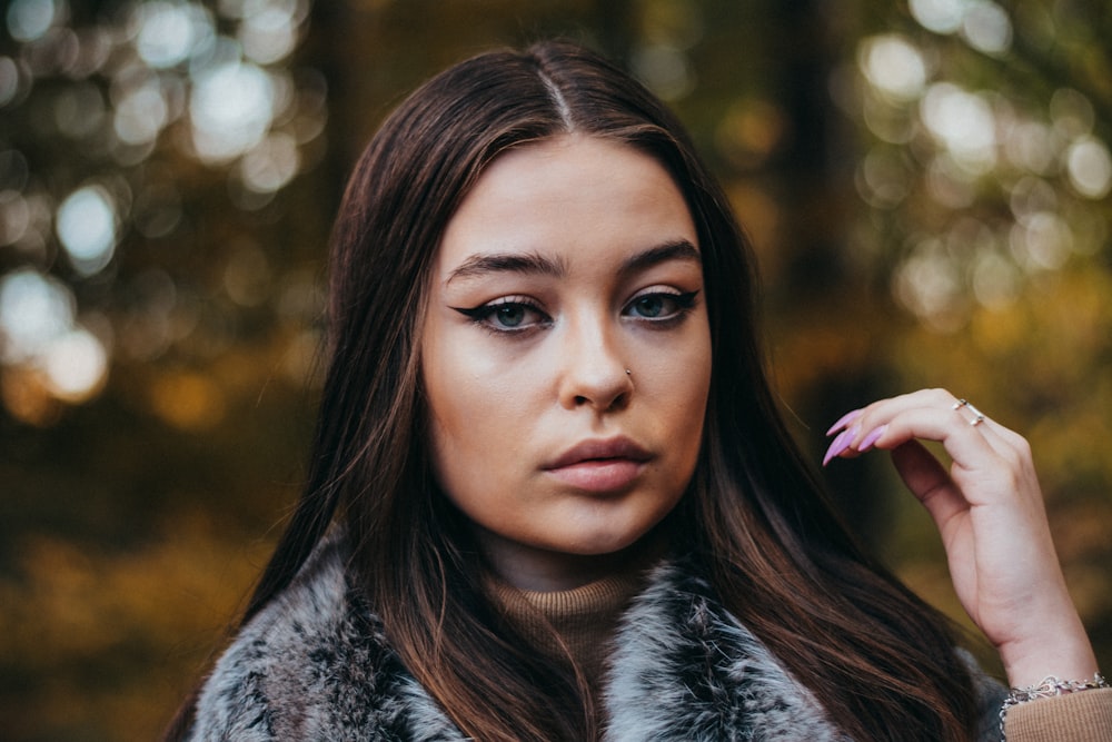 woman in black and white fur coat