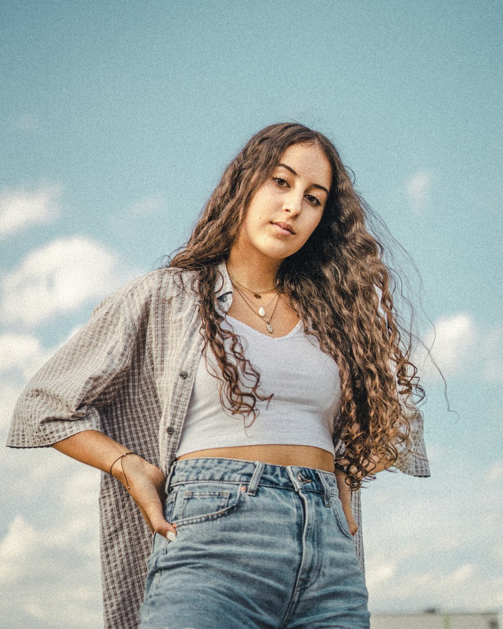 woman in white shirt and blue denim shorts