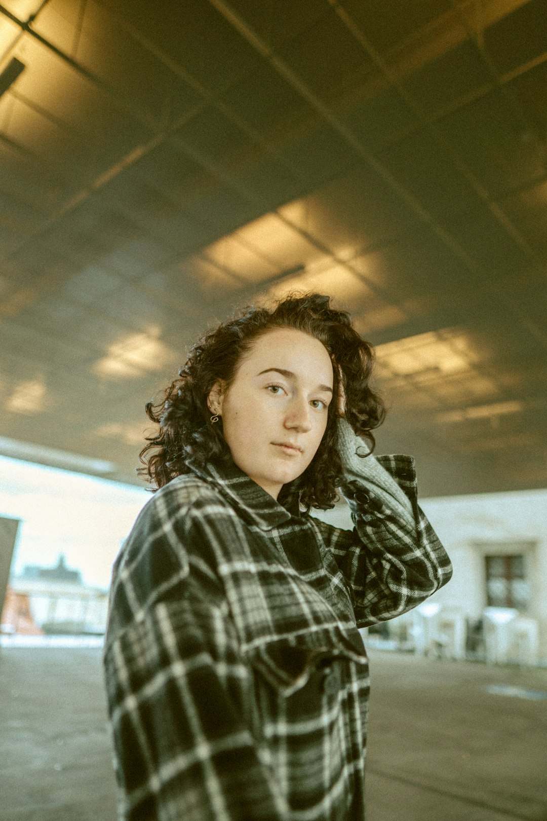 woman in black and white plaid dress shirt