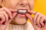 person wearing providental aligners