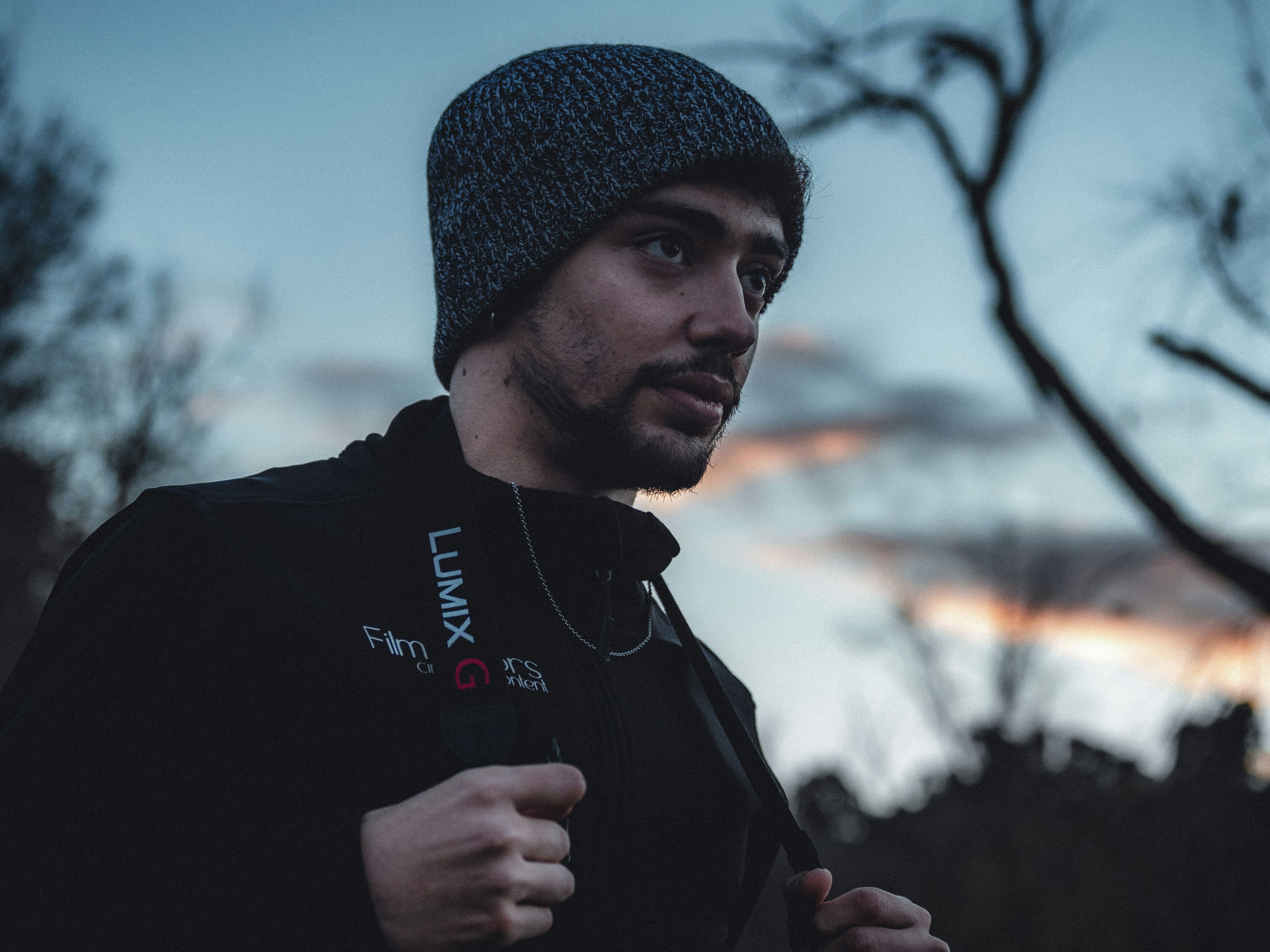 man in black knit cap and black jacket