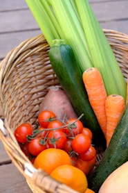 carrots and cucumber on brown woven basket for our provisioning service