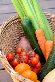 carrots and cucumber on brown woven basket