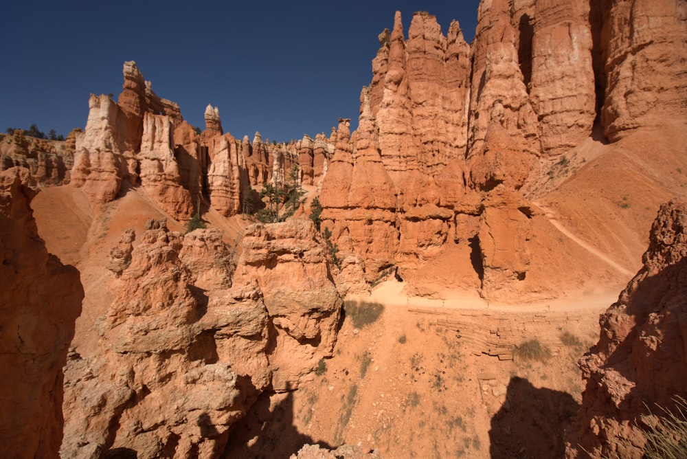 brown rock formation under blue sky during daytime