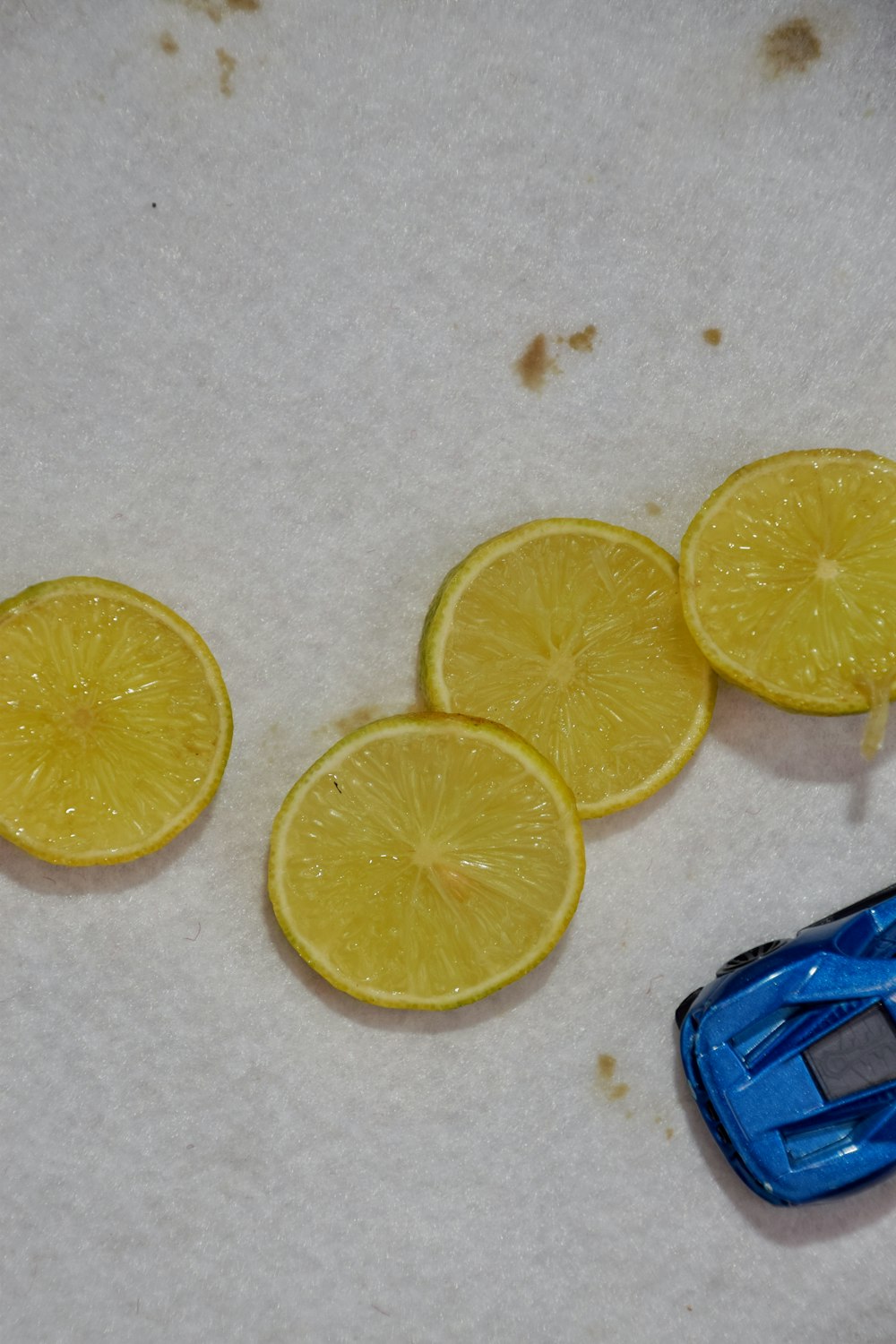 sliced lemon on white table