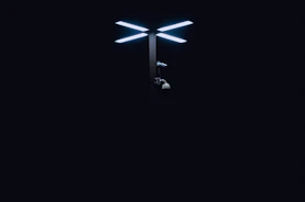 Close-up of high-tech security cameras and bright spotlights guarding the storage area at night