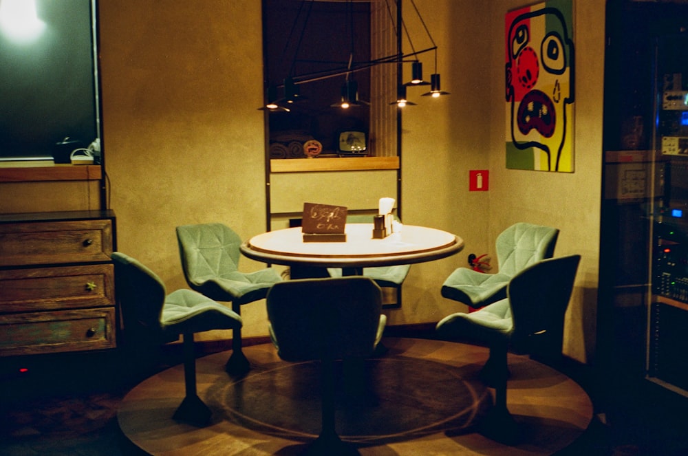 white and brown wooden table with chairs