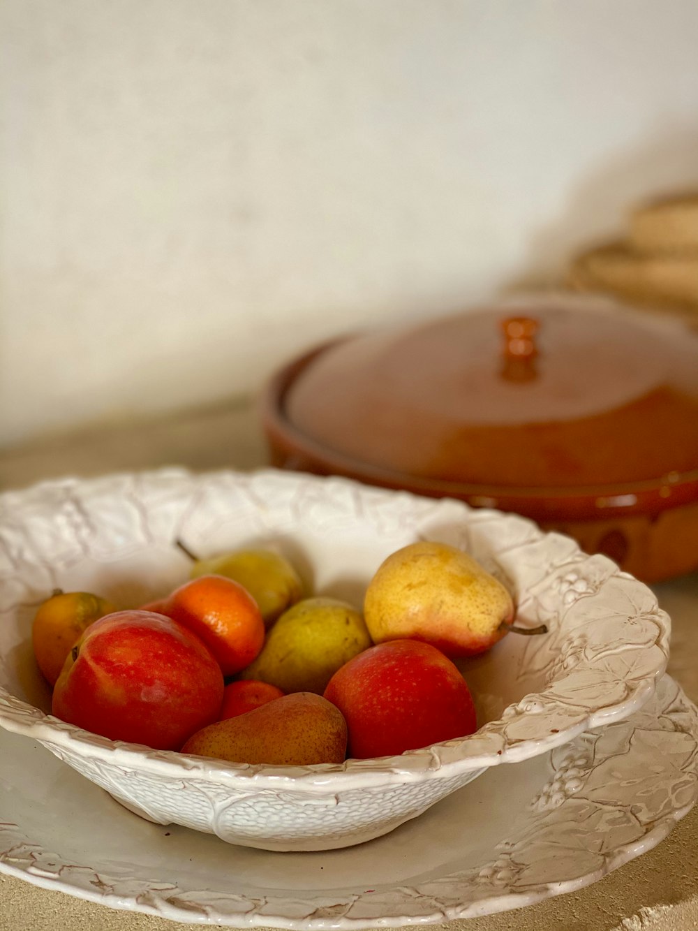 orange fruits on clear glass bowl