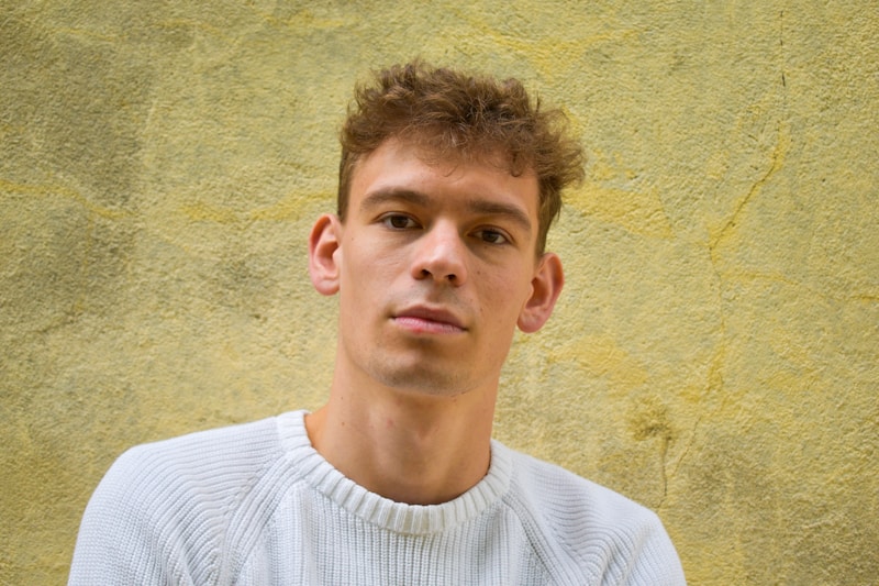 successful man in white crew neck shirt