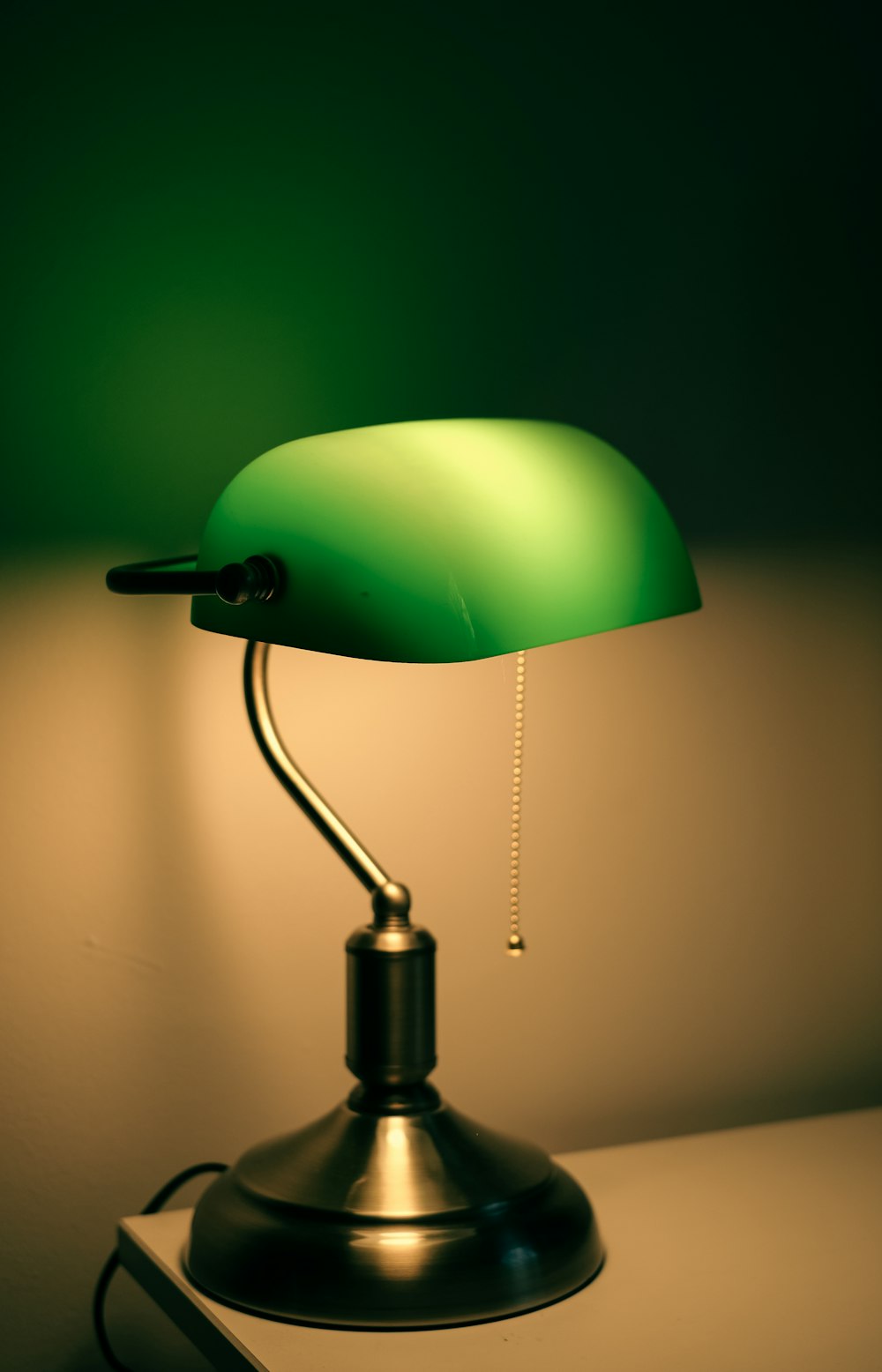 green and silver table lamp