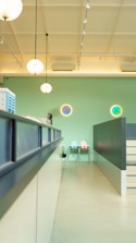 Bright, clean biotech research center focusing on digital molecular screens with subtle blue and green accents.