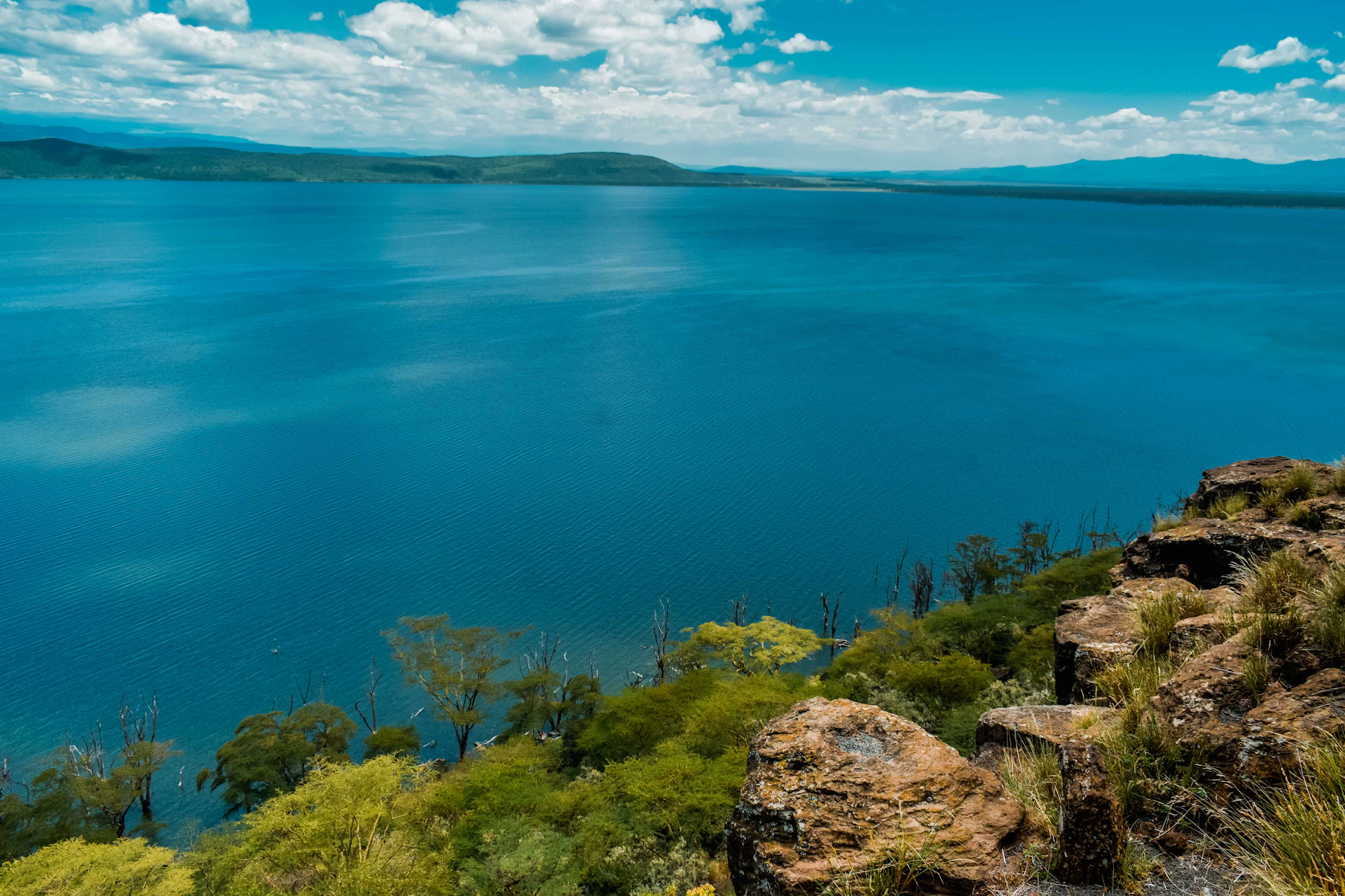 blue body of water under blue sky during daytime