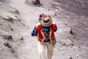 A local guide sharing stories with travelers in a traditional Andean village.