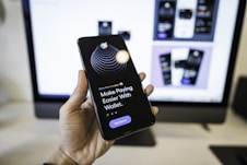 person holding black iphone 4