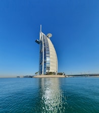 white and black building near body of water during daytime