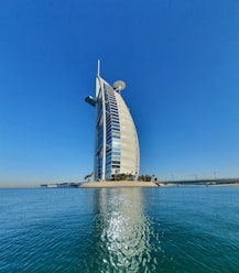 white and black building near body of water during daytime