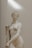 white ceramic statue of a woman