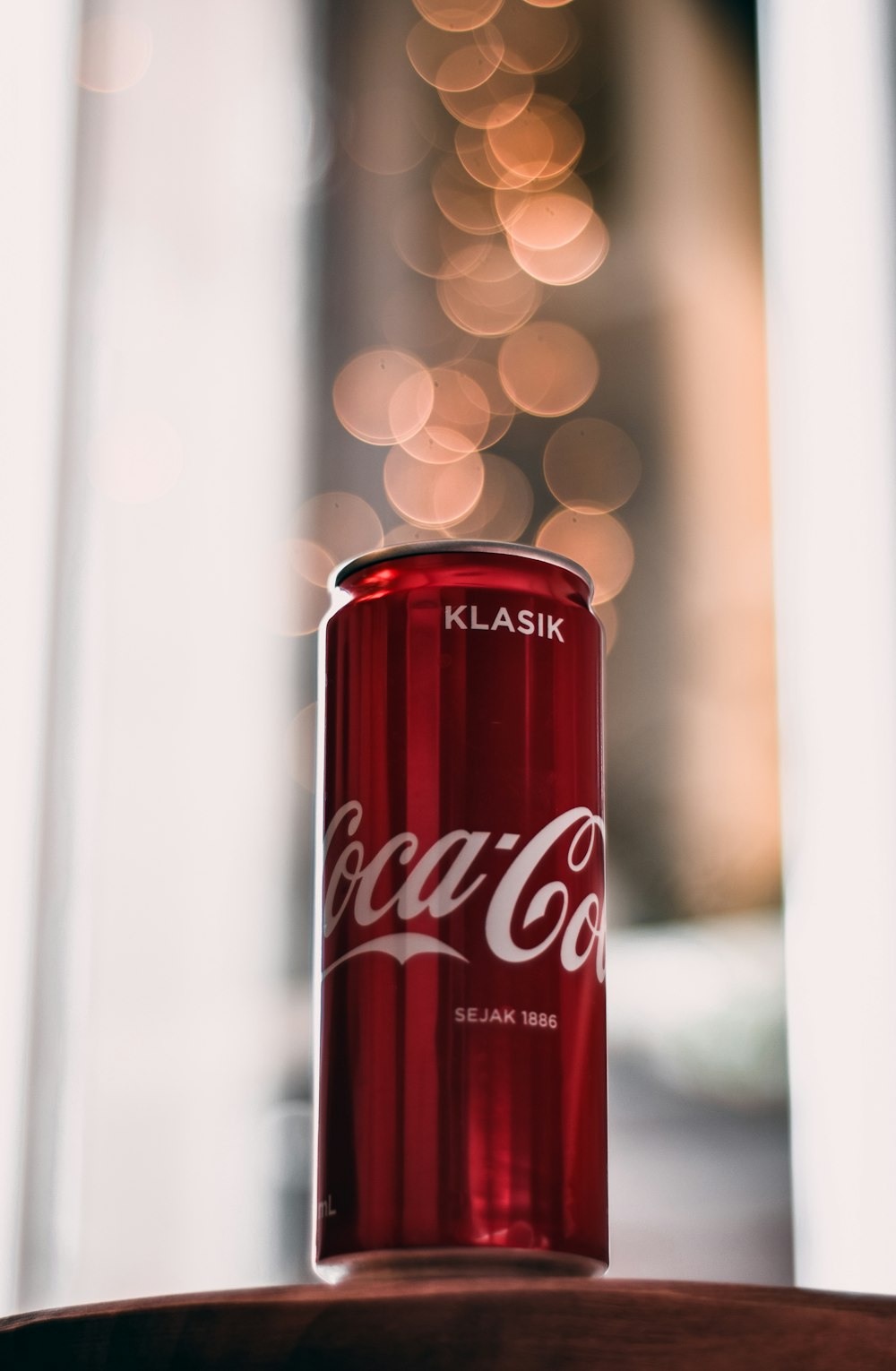 coca cola can on white table