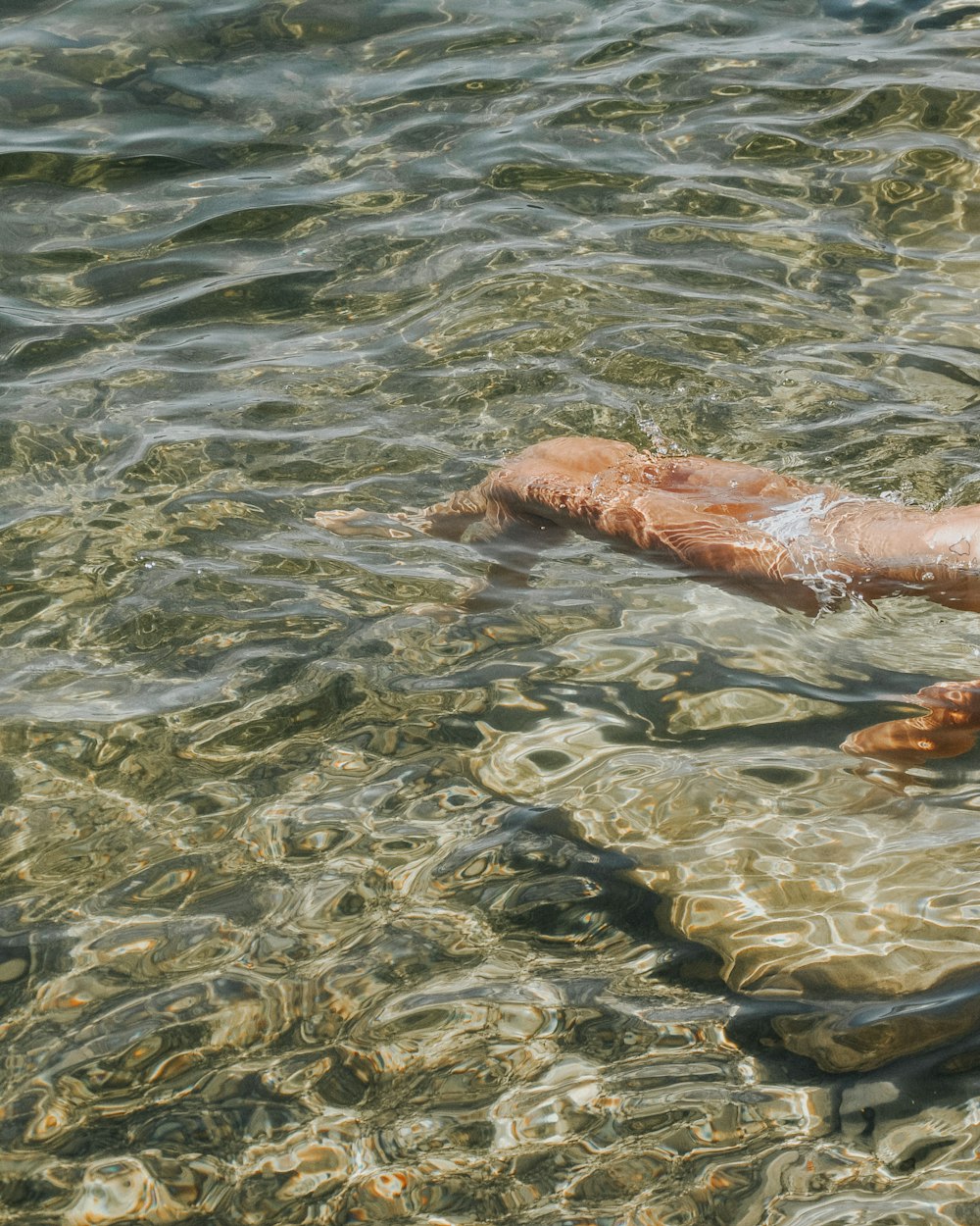 persons feet on water