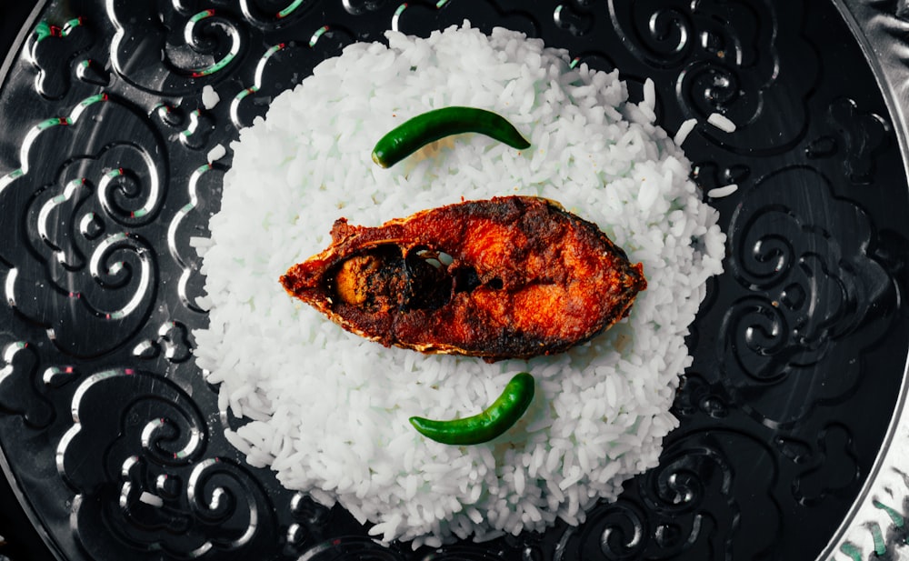 grilled meat with green vegetable on white ceramic plate