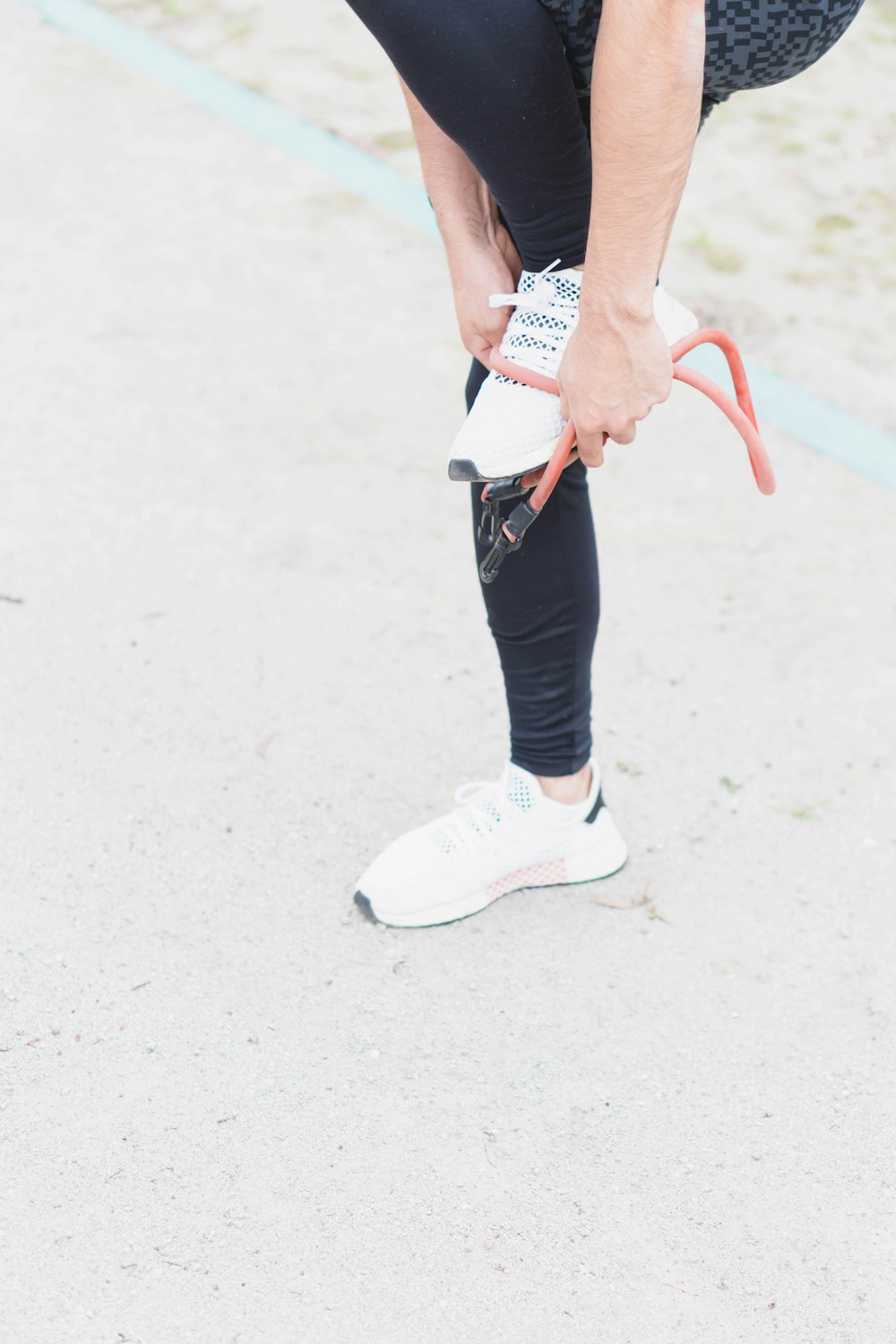 woman in white and black nike sneakers