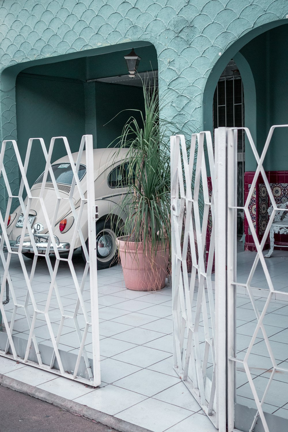 white metal ladder leaning on white metal fence