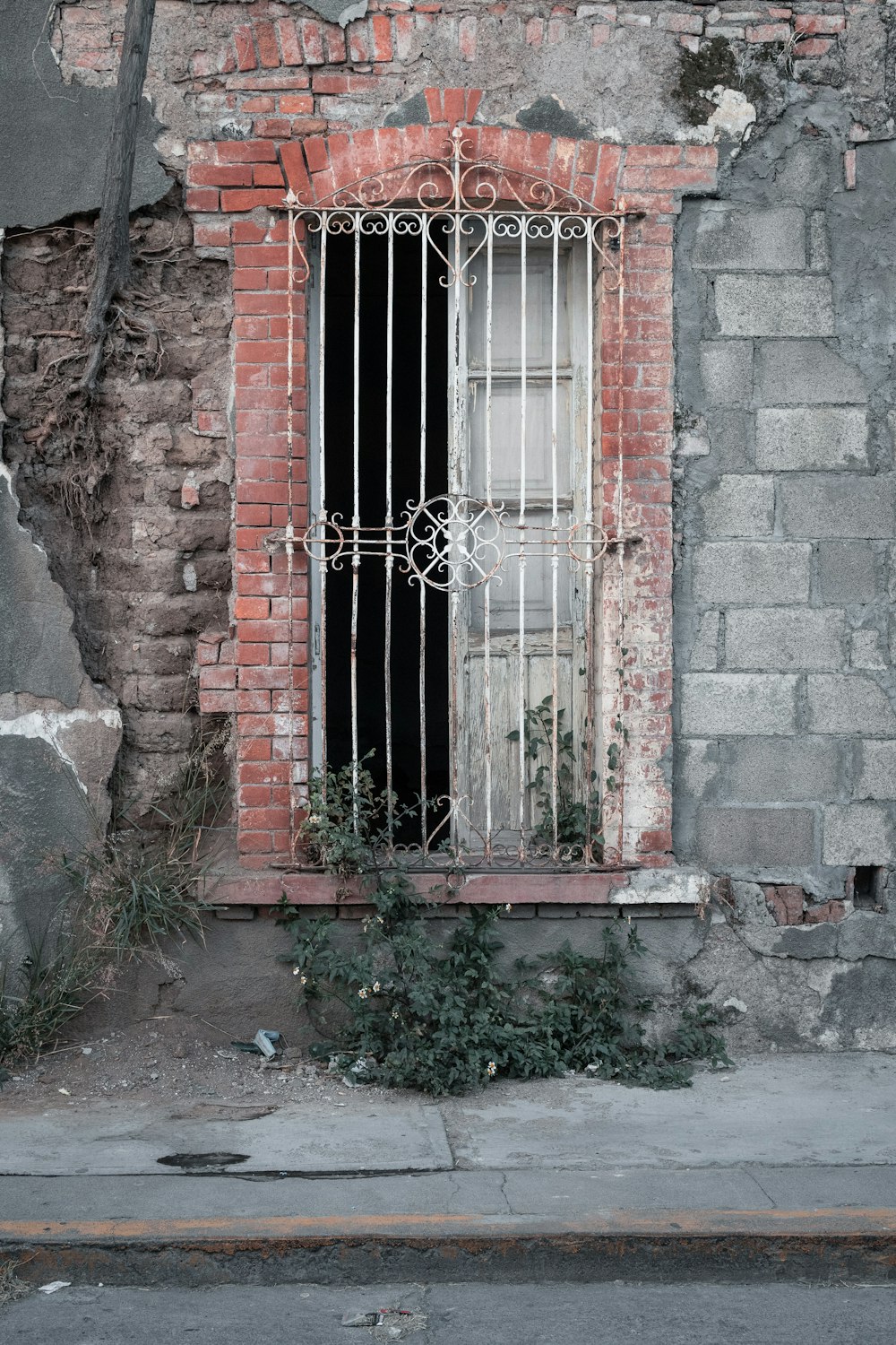 blue wooden door with red brick wall